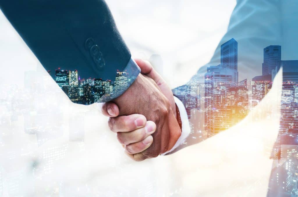 welcome double exposure business man partner handshake